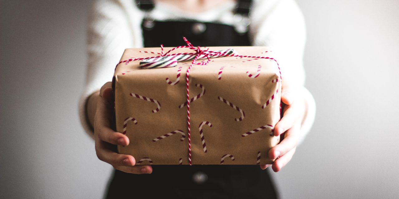 girl giving gift