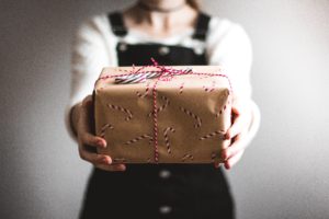 girl giving gift