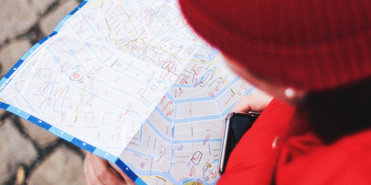 person looking at map for guidance