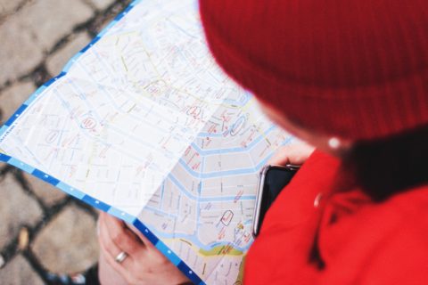 person looking at map for guidance