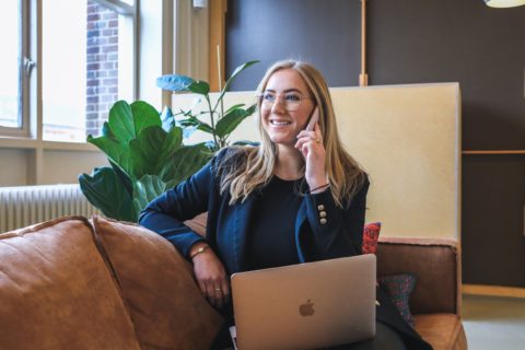 Woman Talking on the Phone with Her Computer