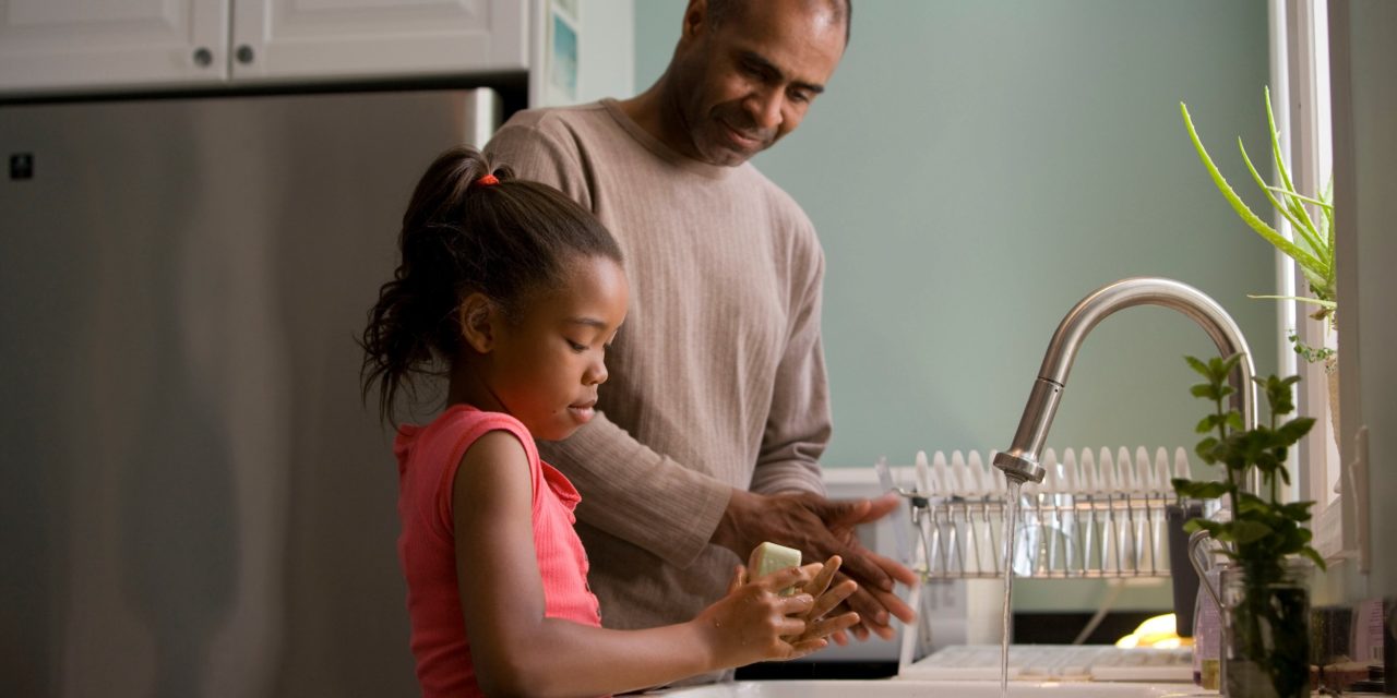 Father and Daughter Washing Hands