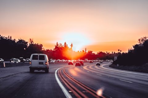 road with cars and sunset