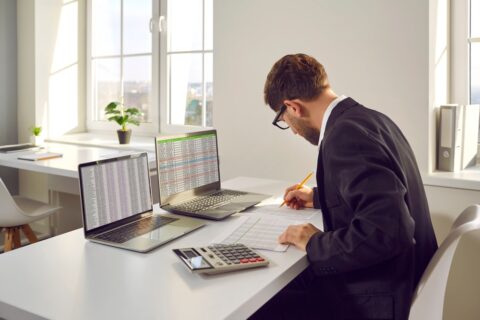 Male,Bookkeeper,Working,With,Financial,Report,In,In,Office.,Man